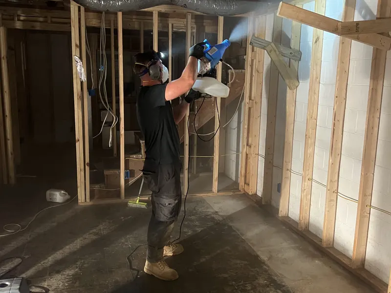 Antimicrobial fogging treatment in a basement remediation